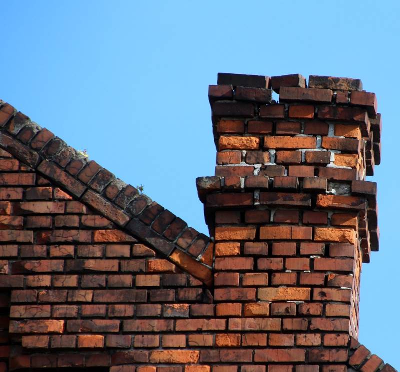 Damaged chimney on an Waukegan home showing cracks and missing mortar